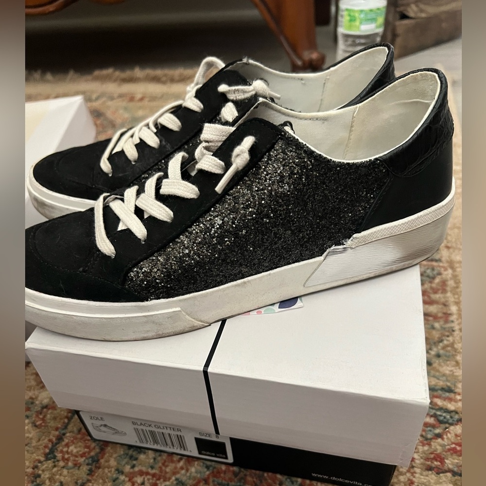 Black glitter sneakers by Dolce Vita.